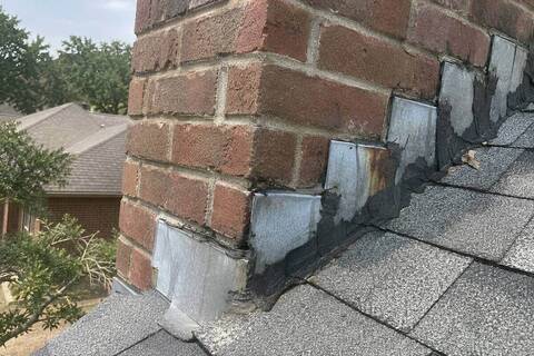 Metal flashing where a chimney meets the shingles, sealant along the joint